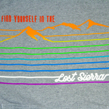 Close up of gray sweatshirt with rainbow mountain design. Text reads, "Find Yourself in the Lost Sierra".